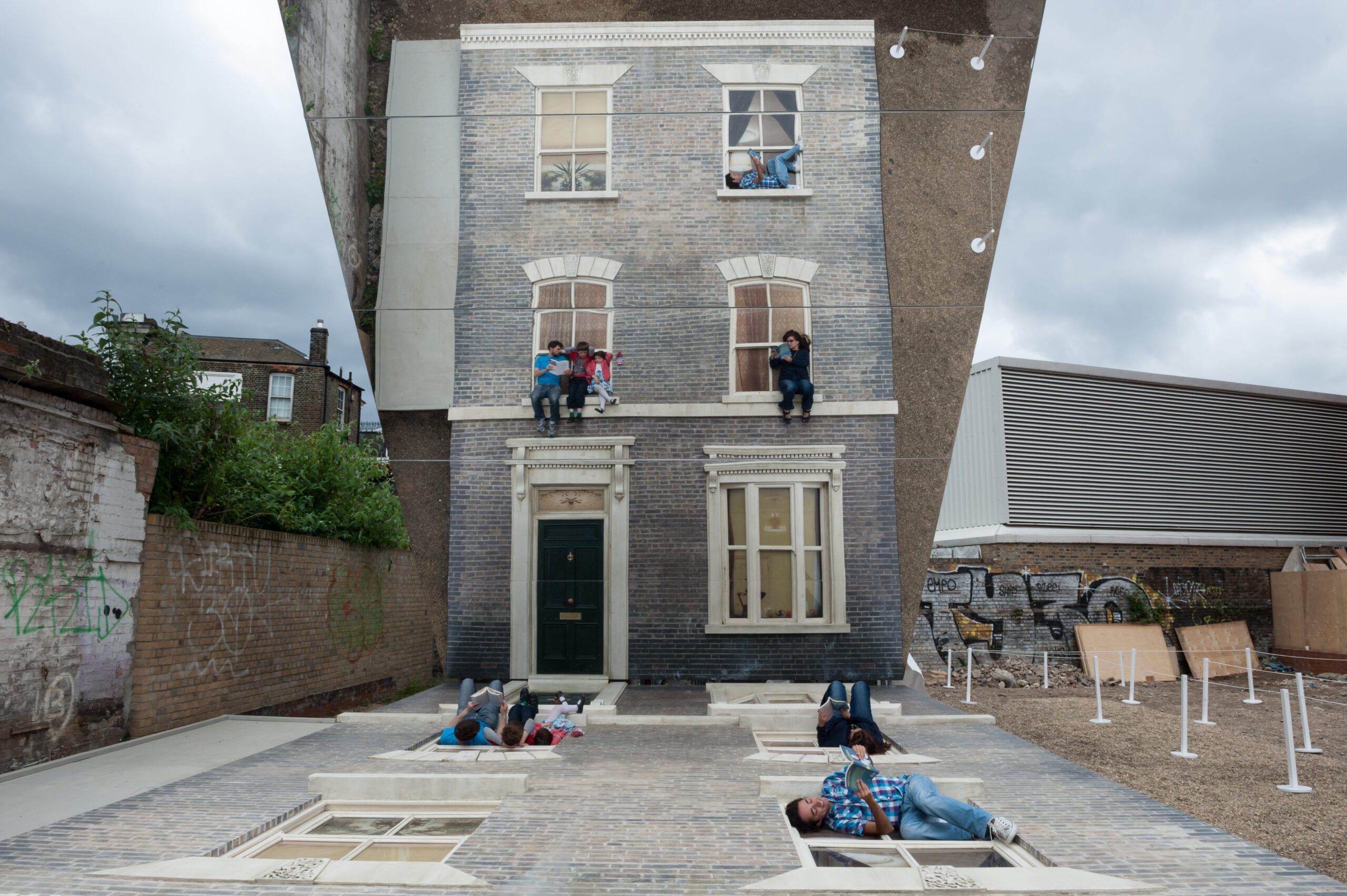 http://installationmag.com/wp-content/uploads/2013/07/Image-1-Leandro-Erlich-Dalston-House.-Photo-by-Gar-Powell-Evans.-Barbican-Art-Gallery-2013.jpg