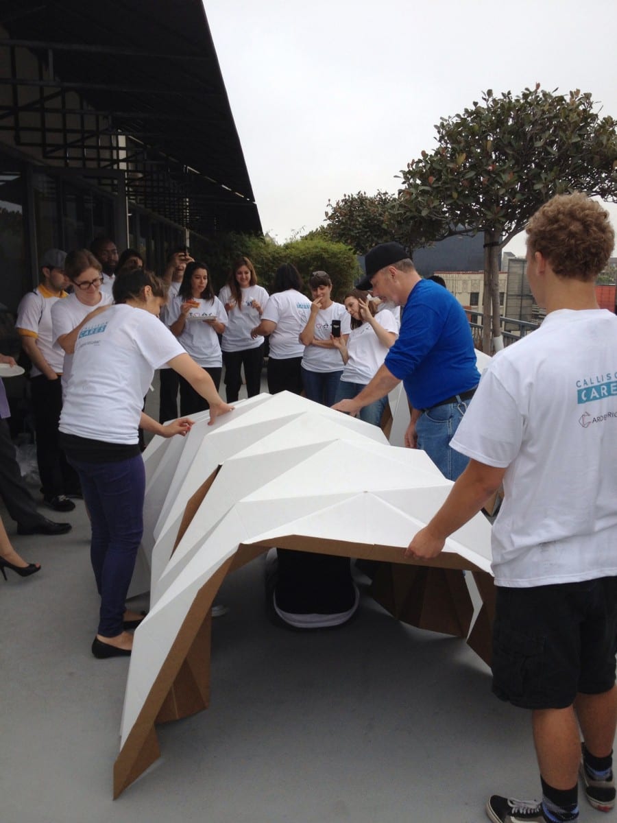 The Callison Cares team in the midst of constructing a Cardborigami cardboard shelter.  © 2013 Callison LLC