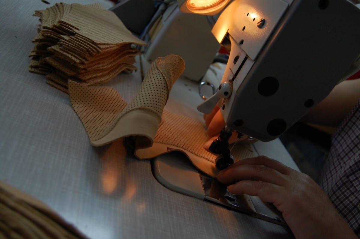 Stitching the perforated calfskin lining for the boot © ATHEIST