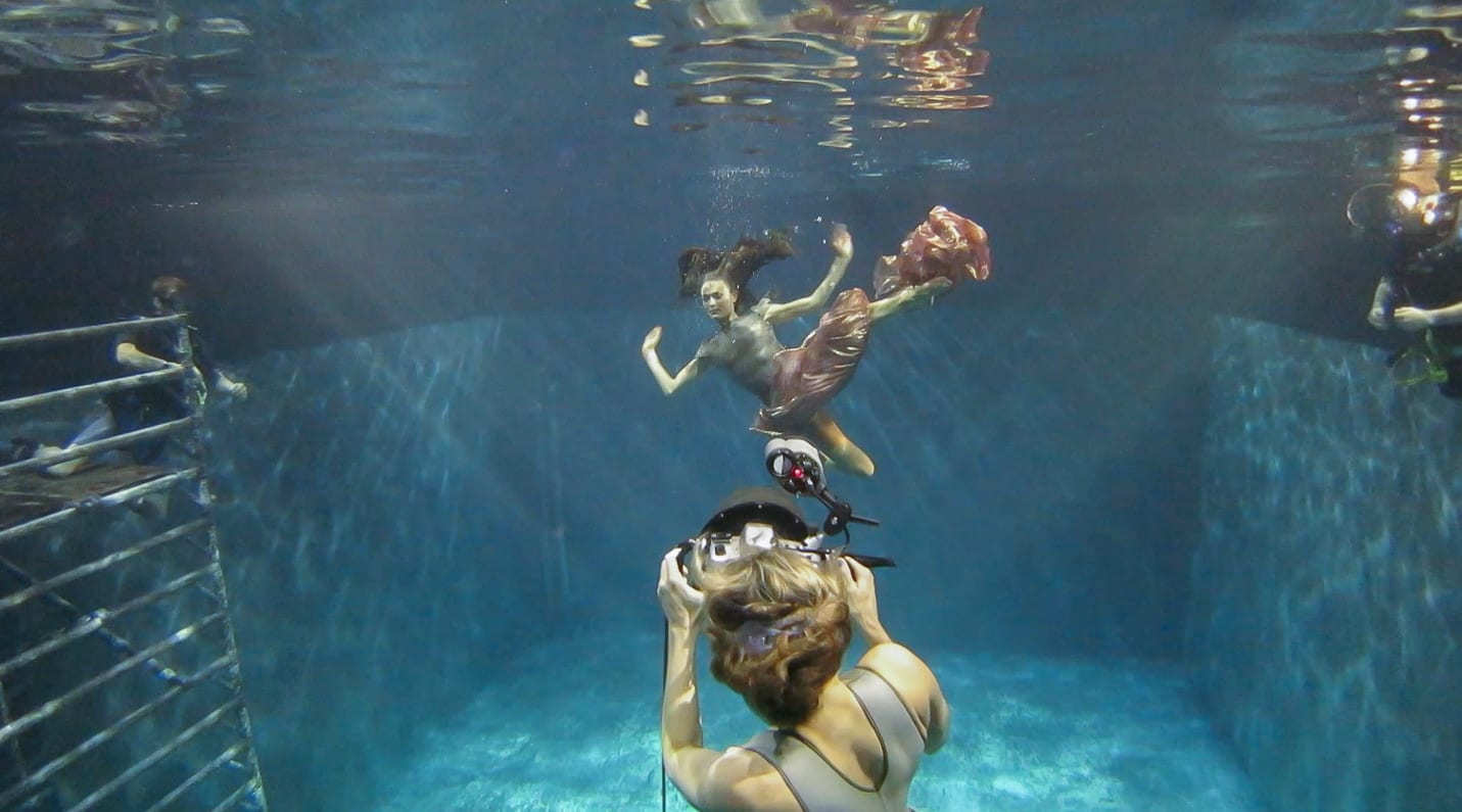 Shooting underwater with two safety divers on each side of the model. Photo by Peter Maia-Tanner. © Maya Almeida 